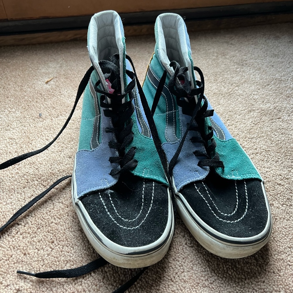Multicolor Vans high tops.